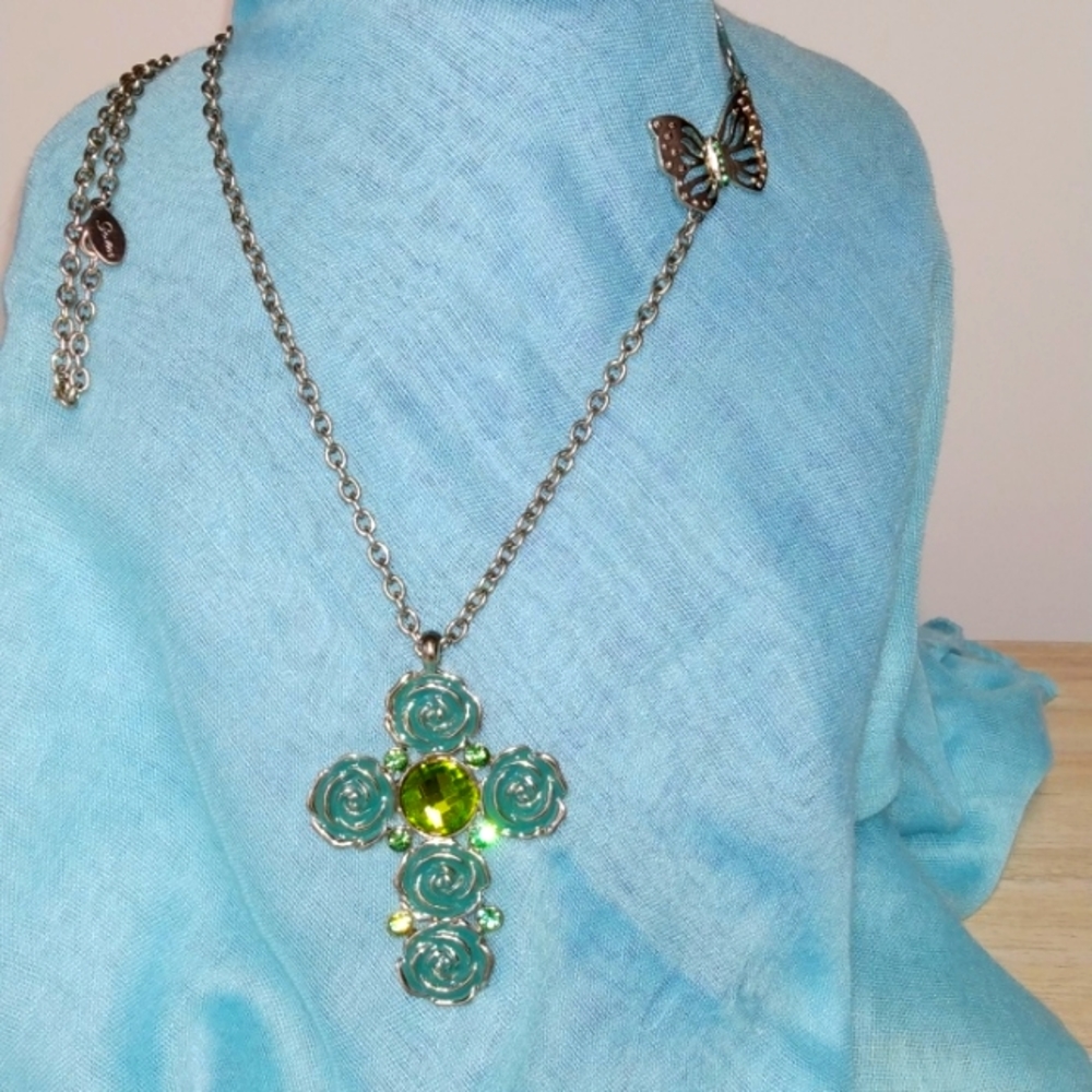 Guess long silvertone chain with a big cross pendant and butterfly enamel guess